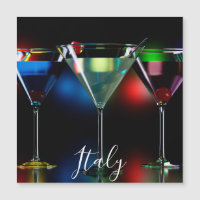 Different cocktails in martini glasses with lights