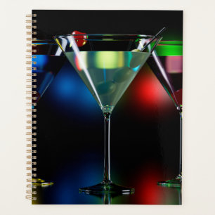 Different cocktails in martini glasses with lights planner