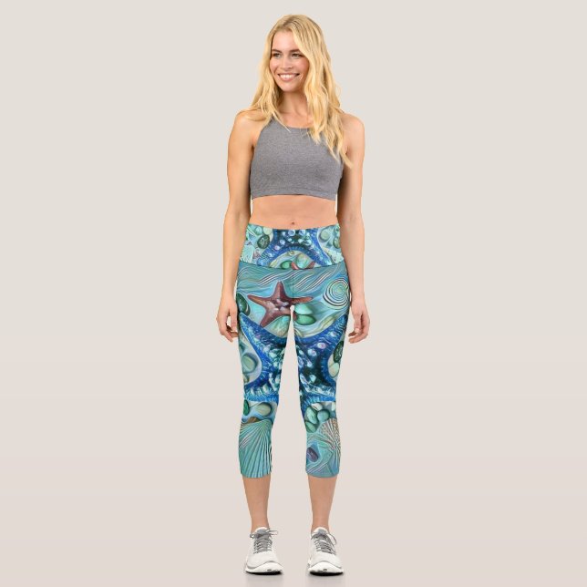 Different types tropical seashells blue painting capri leggings (Front)