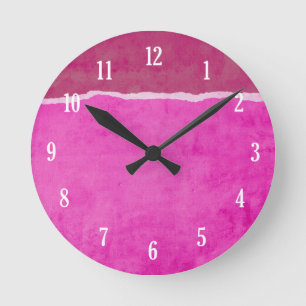 Dirty ripped pink paper round clock