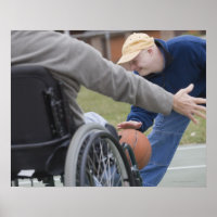 Disabled man playing basketball with his son