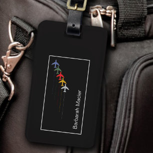 discreet colour aeroplanes aligned on modern black luggage tag