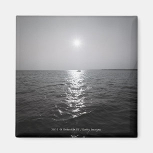 Distant boat on ocean magnet