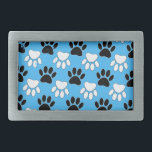 Distressed Black And White Paws On Blue Background Rectangular Belt Buckle<br><div class="desc">A pattern in black and white of dog paw prints with distressed effects on a blue background.
Original design cartoon style</div>