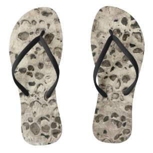 Distressed concrete small stones rocks beach jandals