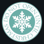 Do Not Open Until Christmas Snowflake Blue Green Classic Round Sticker<br><div class="desc">Use these fun stickers on festive gifts to deter early opening. Design features a white snowflake in a blue green circle. The words "Do Not Open Until Christmas appear around the circle. Copyright © Lisa Marie Robinson. All rights reserved. It is illegal to use or duplicate this, or any of...</div>