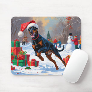 Doberman Running in Snow with Christmas Hat Mouse Pad