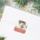 Dog Christmas Photo Happy Pawlidays Address Square Sticker<br><div class="desc">Modern sticker with your favourite photo of your fur baby,  "Happy Pawlidays",  family name,  address in modern serif lettering overlaying festive red background.</div>