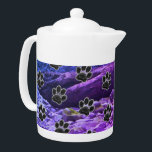 Dog Lover Blue Purple Clouds Black Puppy Paw Print<br><div class="desc">A pattern of black paw prints adorn this teapot.  This teapot features a blue and purple abstract cloud pattern background.  Small black paw prints appear around the entire pot.</div>