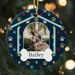 Dog Paw Print Pattern Custom Name Dog House Photo Ceramic Tree Decoration<br><div class="desc">Customise this fun and unique multi-coloured pet paw print pattern ornament design featuring two photos. Design features a dog house design with the door of the dog house featuring your custom pet's photo. Personalise the white dog bone with the pet's name. This is a fun keepsake gift to celebrate your...</div>