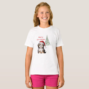 Dog sits with Christmas tree in the background T-Shirt