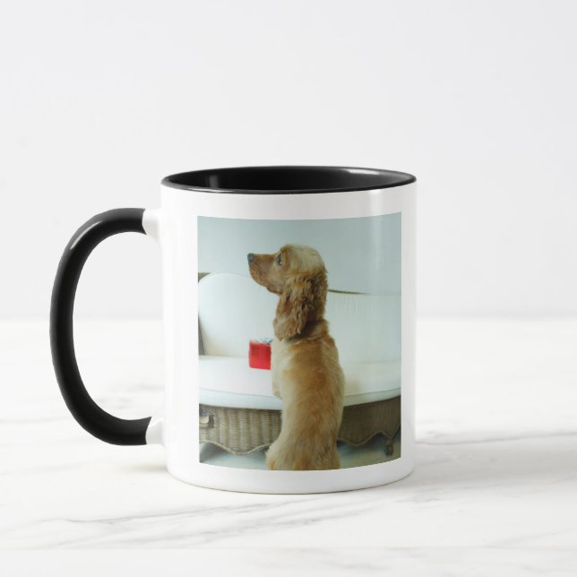 Dog standing on a couch with a gift mug (Left)