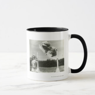 Dogs jumping over miniature high jump bar mug