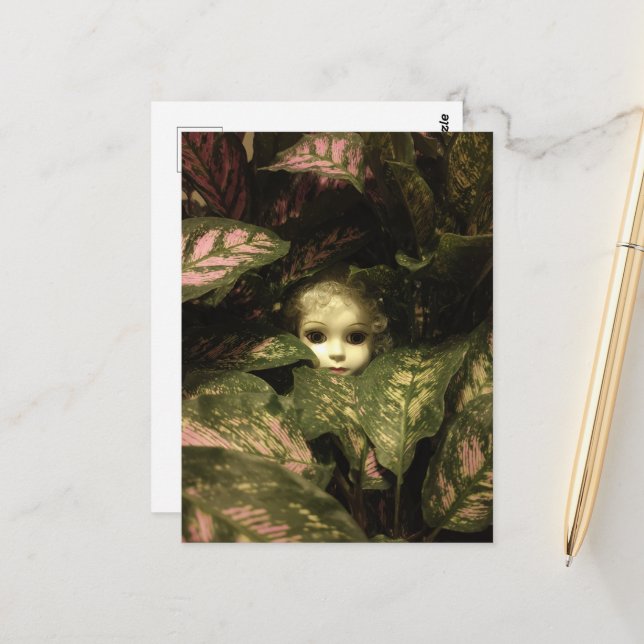 Doll Head in Plants Postcard (Front/Back In Situ)
