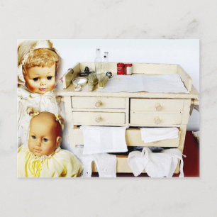 Dolls and vintage changing table postcard