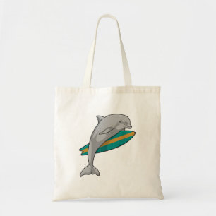 Dolphin as Surfer with Surfboard Tote Bag
