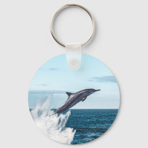 Dolphin leaping out of the ocean key ring