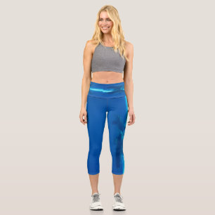 Dolphins and blue ocean , teal and aqua, water capri leggings