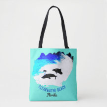 Dolphins swimming Clearwater Beach aqua