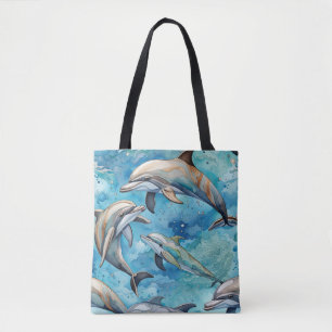 Dolphins swimming in the sea  tote bag