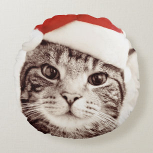Domestic tabby cat wearing red Christmas hat Round Cushion