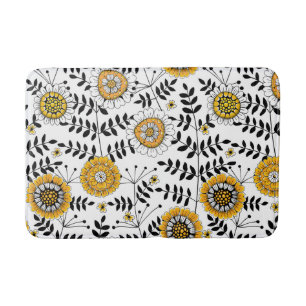 Doodle flowers and leaves in yellow and black bath mat
