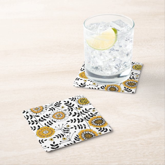 Doodle flowers and leaves in yellow and black square paper coaster (Insitu)