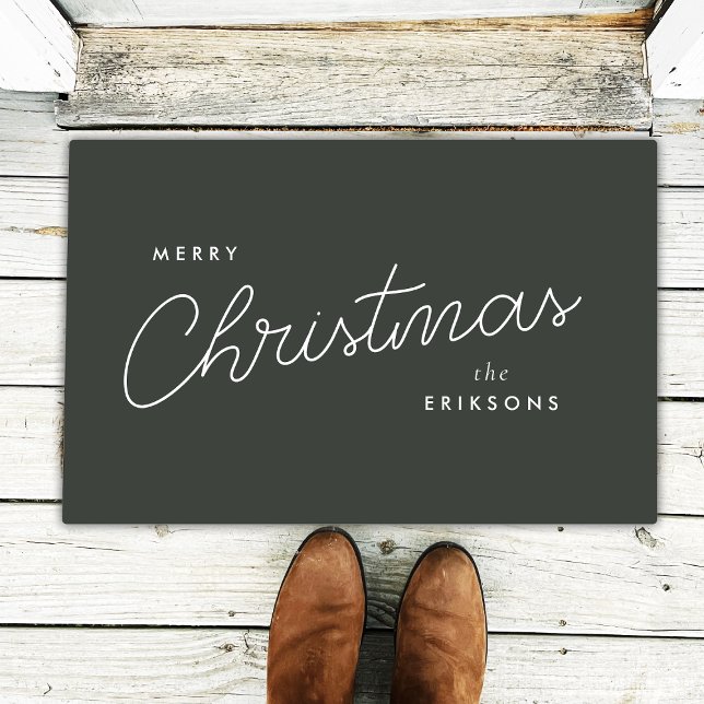 Doormat | Modern Trendy Forest Green Merry Christm (Modern forest green Christmas doormat by Guava, featuring stylish white script & custom name option)