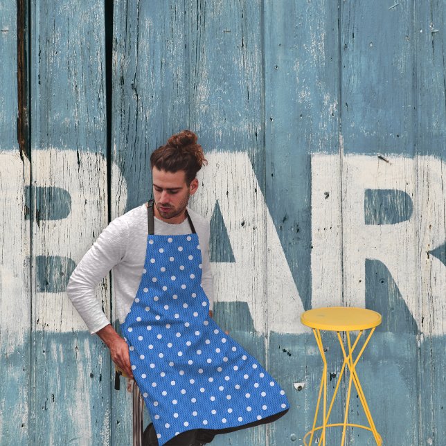 Dotty Delight Blue Apron (A man in a Dotty Delight blue apron is sitting in the bar. )