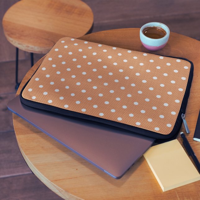 Dotty Delight Orange Laptop Sleeve (A Dotty Delight Green Laptop Sleeve on the table.
)