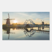 Drawbridge and windmills at sunset in Holland