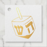 Dreidel favour tags<br><div class="desc">Celebrate eight days and eight nights of the Festival of Lights with Hanukkah cards and gifts. The festival of lights is here. Light the menorah, play with the dreidel and feast on latkes and sufganiyots. Celebrate the spirit of Hanukkah with friends, family and loved ones by wishing them Happy Hanukkah....</div>
