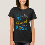 Dreidel Like A Boss Hanukkah T-Shirt<br><div class="desc">Stylish DREIDEL LIKE A BOSS Hanukkah T-Shirt, designed with blue dreidel and blue, yellow and white typography. In the top right hand corner, you can read the names of the four dreidel sides in a word puzzle format (HEI can be changed to HEY or HAY, if required). Inside the O...</div>