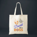 Dreidel Like A Boss Hanukkah Tote Bag<br><div class="desc">Stylish DREIDEL LIKE A BOSS Hanukkah Tote Bag designed with orange dreidel and blue, orange and black typography. In the top right hand corner, you can read the names of the four dreidel sides in a word puzzle format (HEI can be changed to HEY or HAY, if required). Inside the...</div>