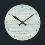 Driftwood Ocean Beach House Coastal Seashore Round Clock<br><div class="desc">COLOR PALETTE: Soft grey, blue and tan DESIGN COLLECTION: This entire collection of Beach House Home Décor Accessories can be personalised with your name, monogram or message. Use the easy to customise template fields. Hand painted in watercolor, this simple yet trendy driftwood, worn, faded, distressed antiqued wooden background has great...</div>