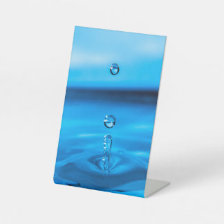 dropped water drop pedestal sign