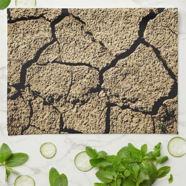 Dry land with cracked earth in drought tea towel (Folded)