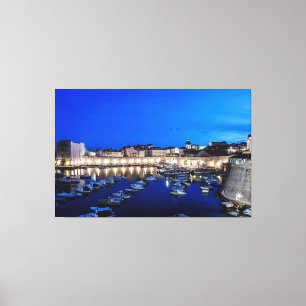 Dubrovnik harbor and walls illuminated at night canvas print