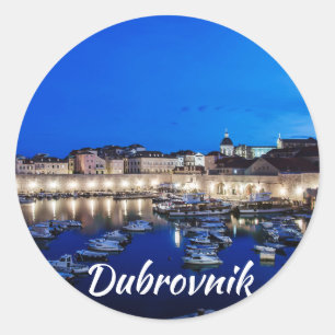 Dubrovnik harbor and walls illuminated at night classic round sticker