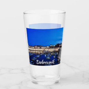 Dubrovnik harbor and walls illuminated at night glass