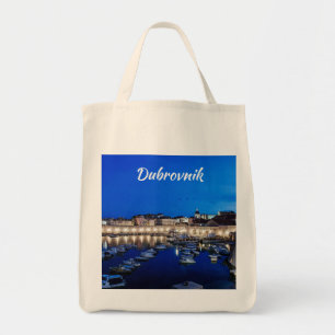 Dubrovnik harbour and walls illuminated at night tote bag
