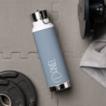 Dusty Blue Modern Typography Personalised Water Bottle<br><div class="desc">Trendy, vacuum insulated water bottle that features personalised name in white, modern typography on a trendy, dusty blue colour background. Personalise bottle by editing name and replacing name with your own as desired. Perfect for a birthday gift, wedding groomsman gift, etc. Select your water bottle style. Select your water bottle...</div>