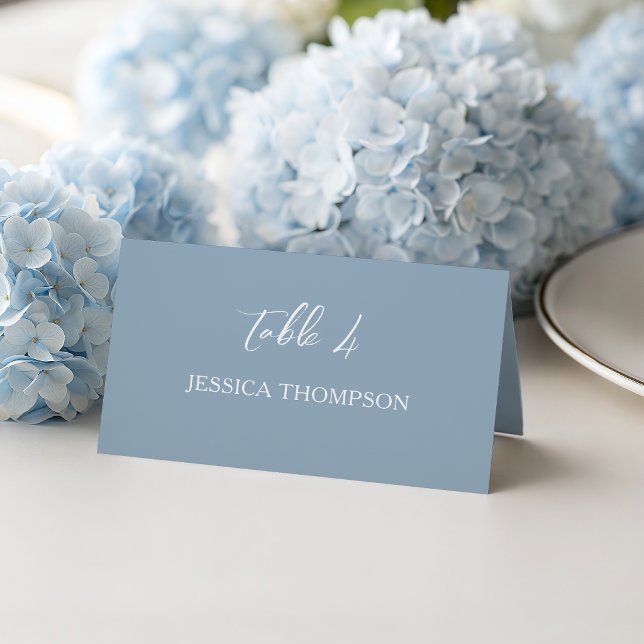 Dusty Blue Simple Script Elegant Wedding Table Place Card (Elegant and simple dusty blue with white script text and classic serif. A perfect wedding blend.)