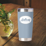 Dusty Blue Stylised Wedding Groomsman Name Insulated Tumbler<br><div class="desc">Gift your wedding groomsman with this trendy and personalised,  stainless steel,  thermal tumbler with his name in stylised script in a white oval design. Background colour and script is dusty blue. Personalise your thermal tumbler by editing and replacing groomsman's name with desired name.</div>