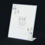 Dusty Blue Wildflower Bridal Shower Mimosa Bar Pedestal Sign<br><div class="desc">Set the tone for celebration with this refined Mimosa Bar sign—an understated nod to your hostess savvy. Featuring signature Blossom & Bliss typography and a whisper of wildflower detailing, it blends seamlessly into a curated drink station while guiding guests with elegant clarity. Perfect for brunch showers, morning-after breakfasts, or any...</div>