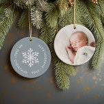 Dusty Blue Winter Snowflake First Christmas Photo Ceramic Tree Decoration<br><div class="desc">Ceramic holiday ornament personalised with your baby's photo and custom "My First Christmas" text. This simple modern holiday design features a white snowflake on a dusty blue background. Use the design tools to choose any background colour, edit text fonts and colours and add your own photos to create your own...</div>