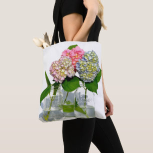 Dusty pink blue yellow green floral hydrangeas tote bag