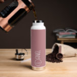 Dusty Rose Modern Typography Personalised Water Bottle<br><div class="desc">Trendy, vacuum insulated water bottle that features personalised name in white, modern typography on a trendy, dusty rose colour background. Personalise bottle by editing name and replacing name with your own as desired. Perfect for a birthday gift, wedding groomsman gift, etc. Select your water bottle style. Select your water bottle...</div>