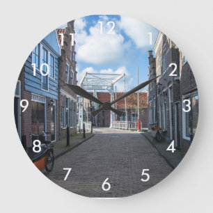 Dutch village with traditional wooden bridge large clock