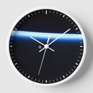 Earth's Thin Line Of Atmosphere And A Gibbous Moon Clock